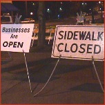 [businesses open, sidewalk closed]