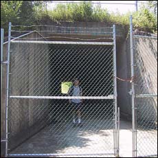 the view through the gate that blocks the tunnel under I-89