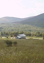 [long shot of the barn]