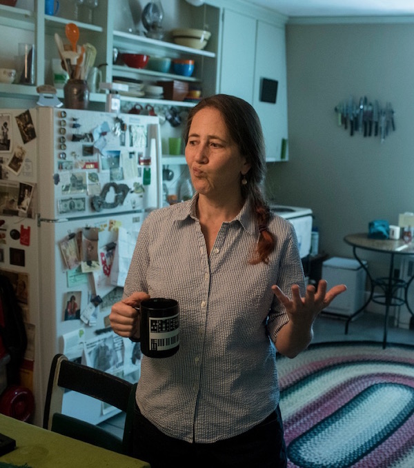 photo of me in my kitchen holding a coffee mug