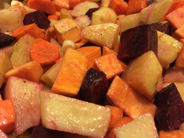 close up of a tray of roasted veggies in oranges and reds and beiges